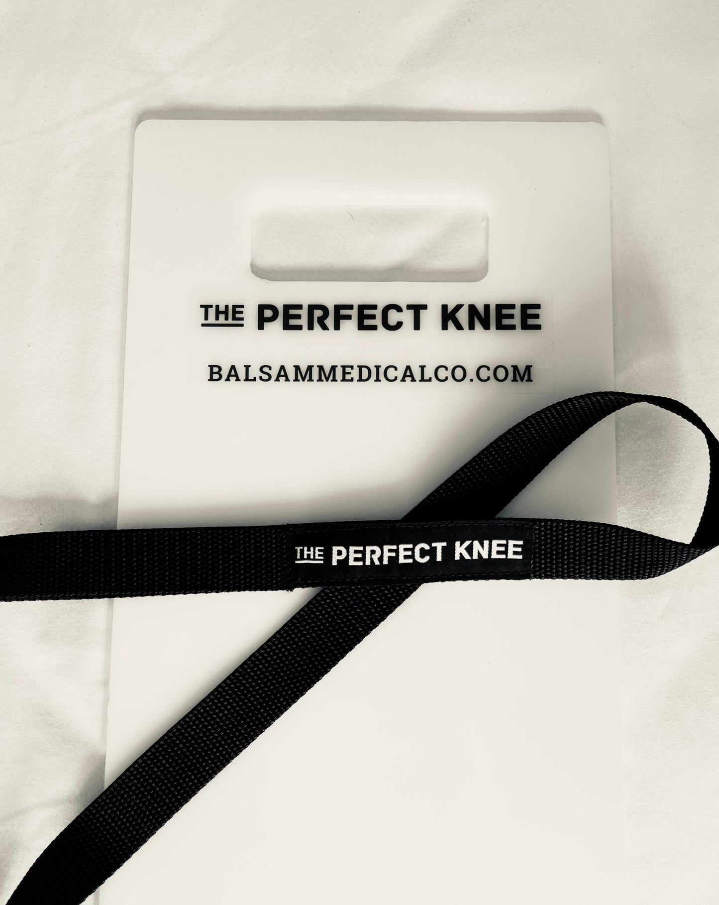 Knee slide board and strap to regain knee flexion range of motion